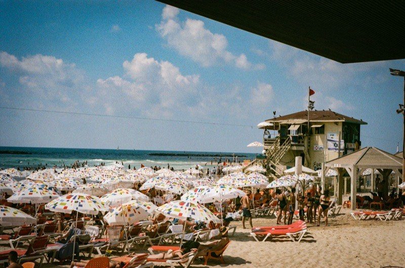 Sun umbrellas crowding a Tel Aviv beach