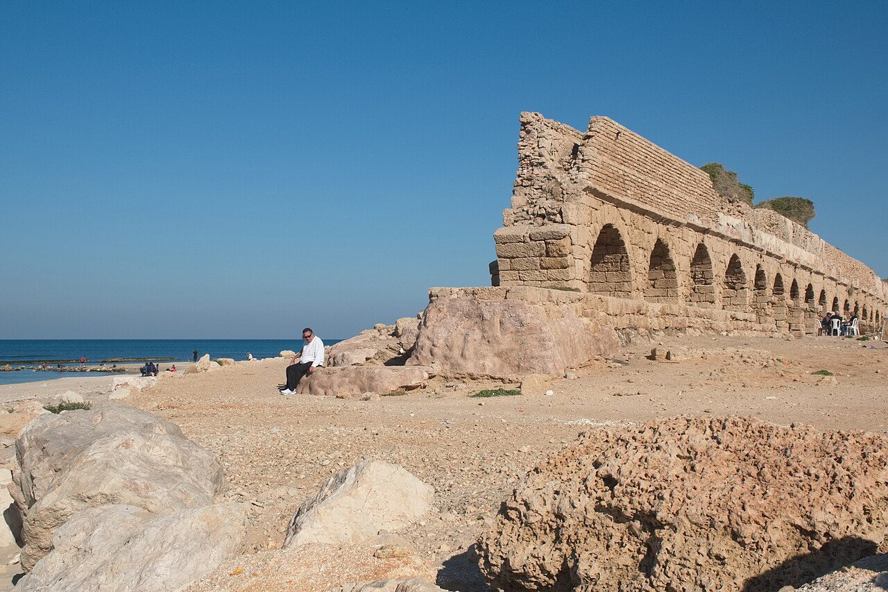 The ancient Roman aqueduct on the beach at Caesarea, Israel
