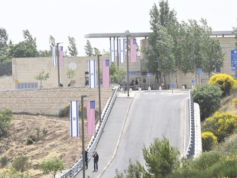 American and Israeli flags lining the approach to the U.S. Embassy in Jerusalem