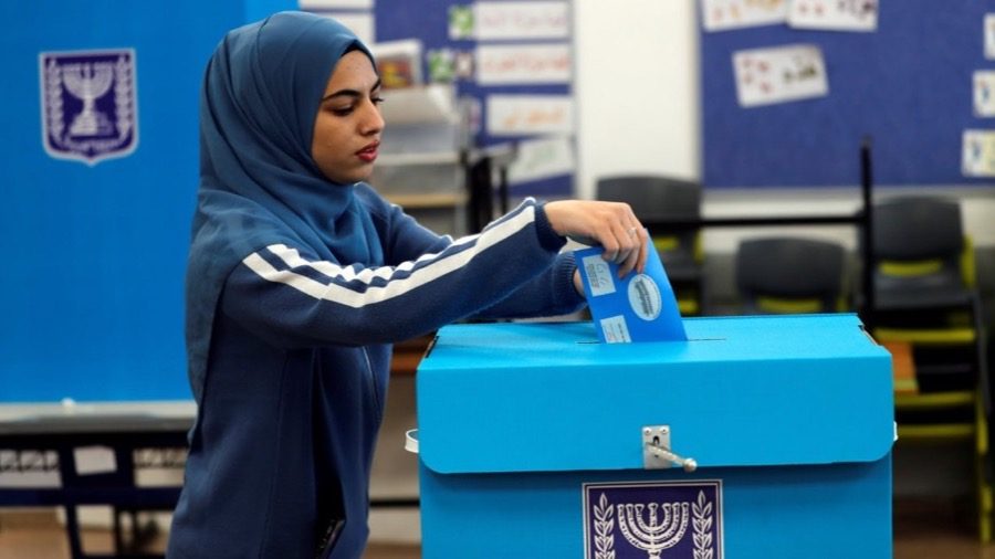 An Arab-Israeli woman casting her ballot at a polling station in Israel
